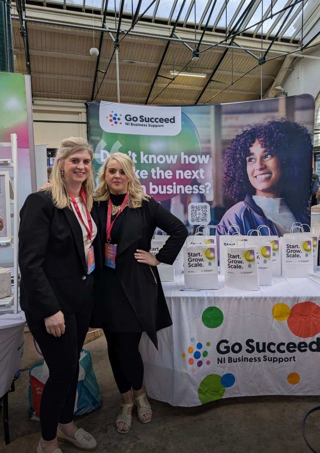 LMPM at a Go Succeed business support event, alongside branded bags produced for the stand