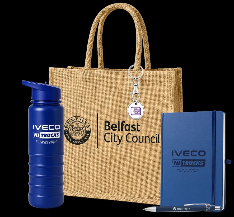 Branded merchandise made for real clients: a Belfast City Council jute bag, IVECO NI Trucks bottle and notebook, and a printed pen and keyring